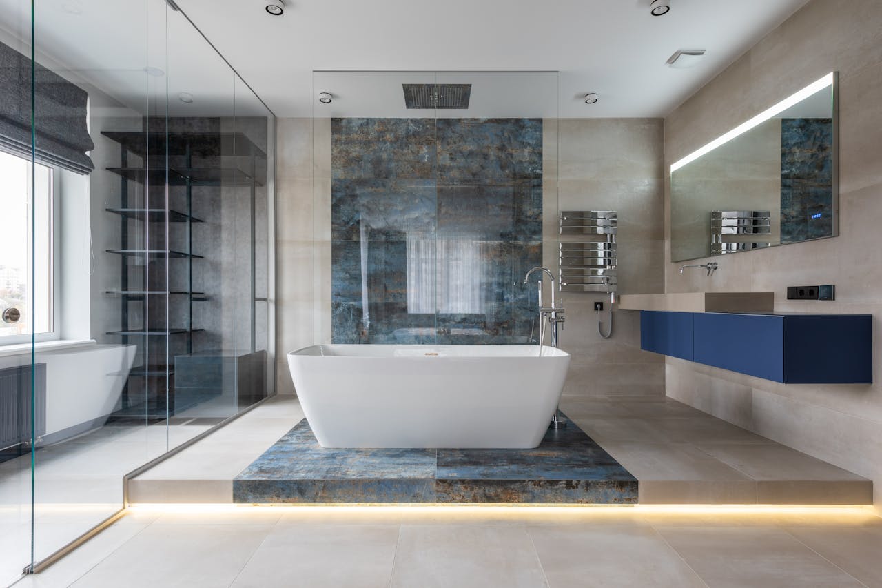 about-us Elegant bathroom featuring a ceramic freestanding tub and contemporary design elements.